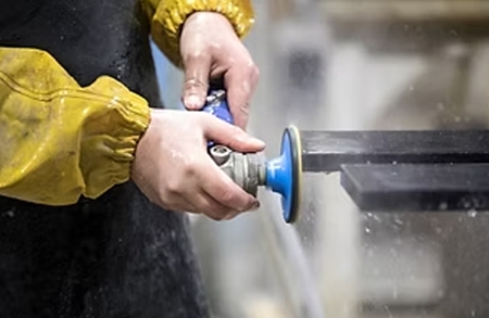 Polishing the edge of a stone countertop slab