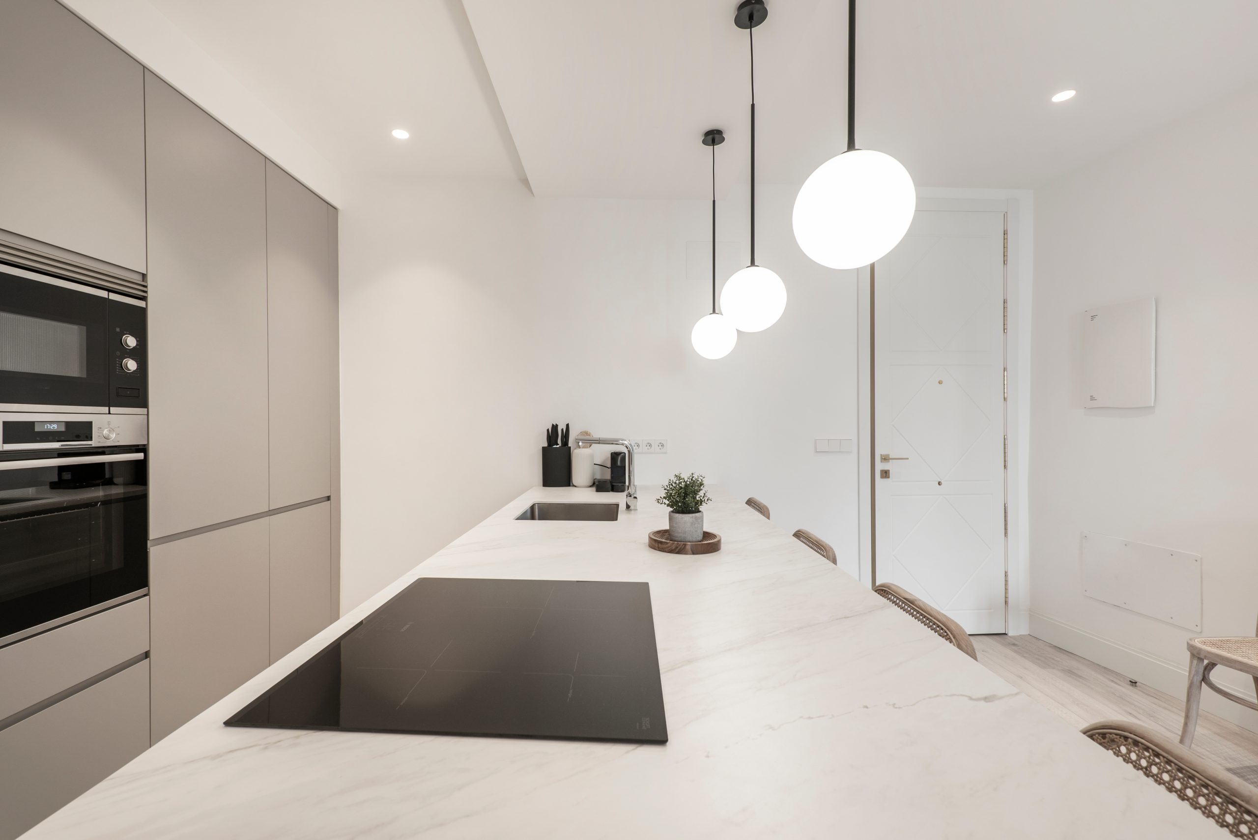 Book-matched veined stone kitchen island countertop in a bright Nashville kitchen