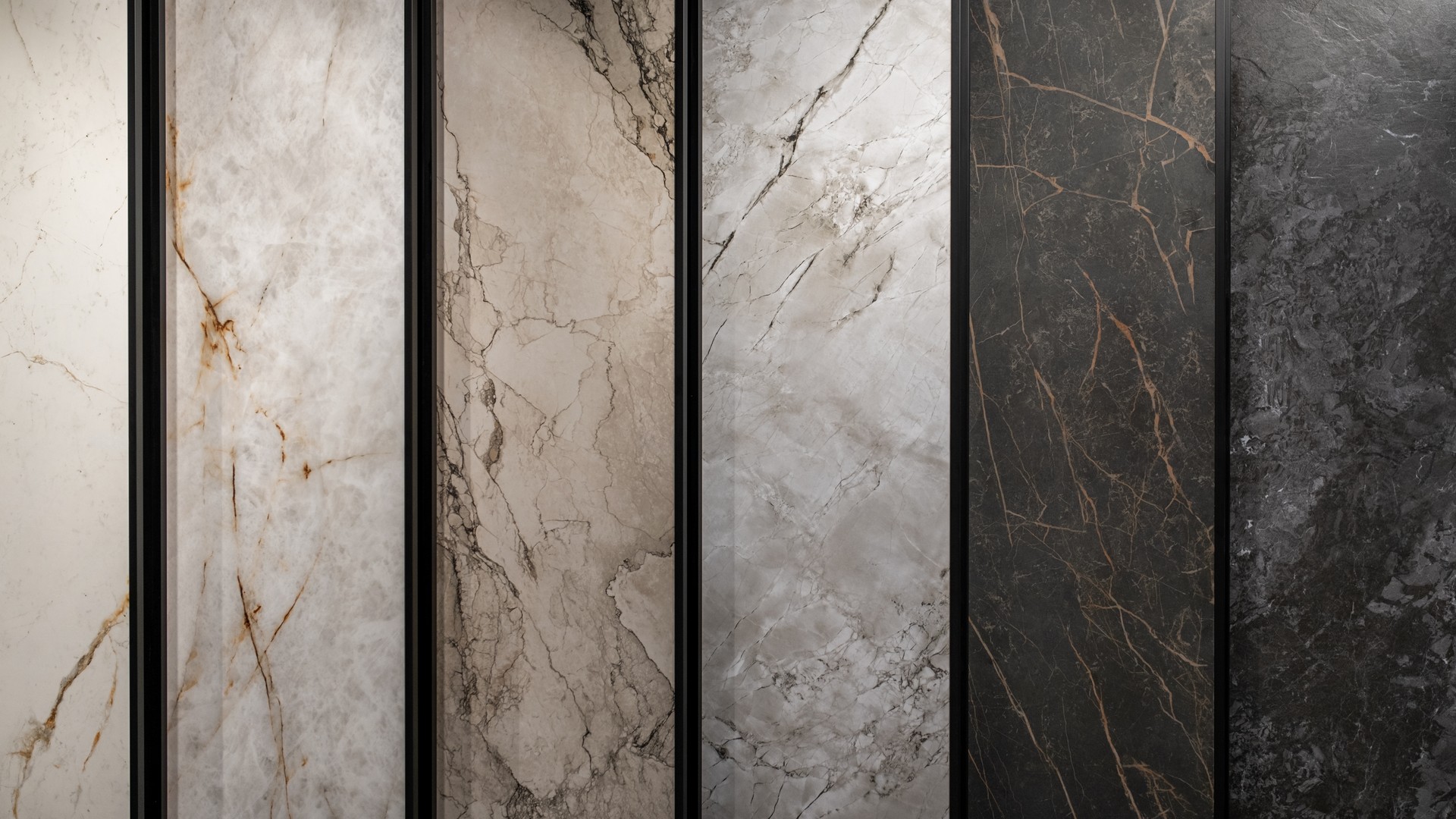 Vertical natural stone slab panels in marble and quartzite displayed on end in a Nashville showroom rack