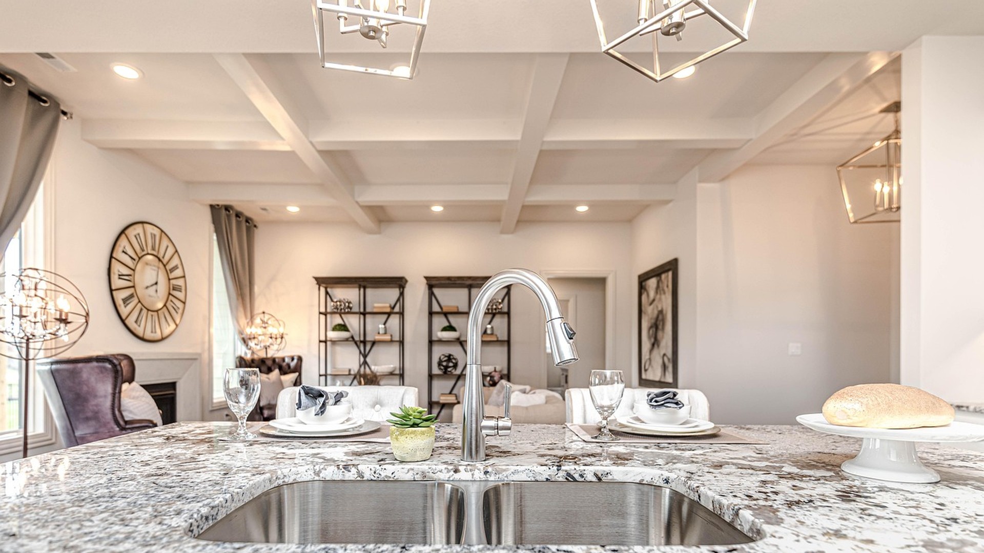 Speckled natural granite island countertop with an undermount sink in an upscale Nashville kitchen