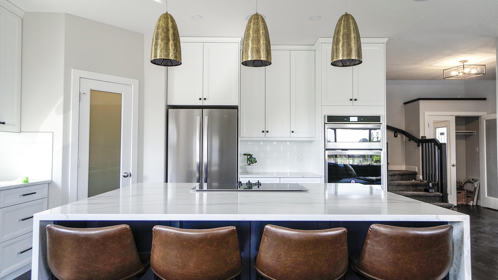 Modern Nashville kitchen with a veined marble island countertop as the statement centerpiece